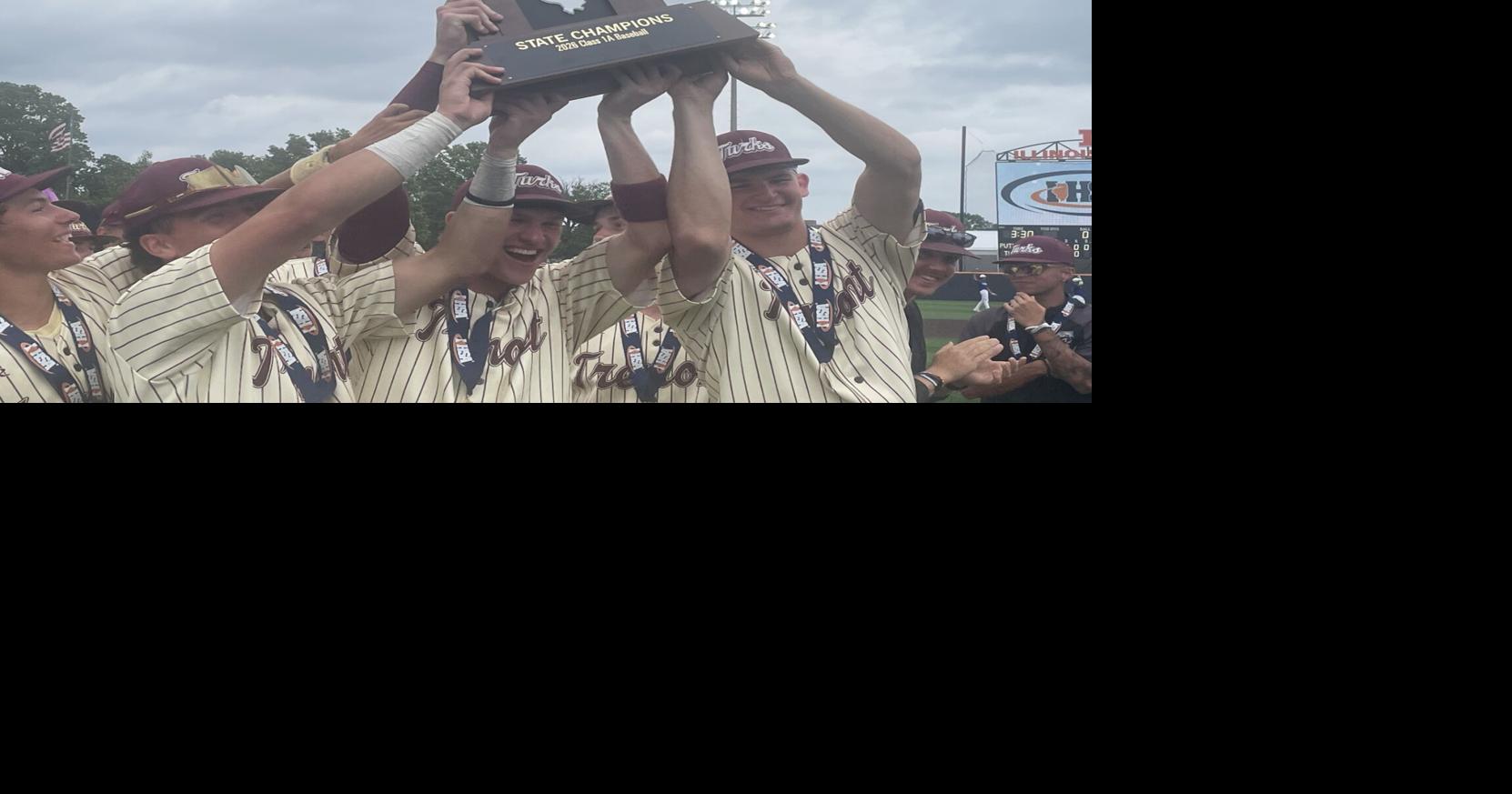 Tremont holds up 1A state championship trophy