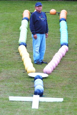 Man makes 70-foot rosary of bowling balls
