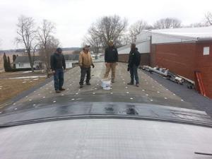 Men starting roof.jpg