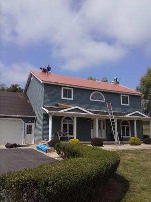 Red metal roof with workers.jpg