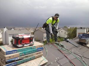 Top of roof man.jpg
