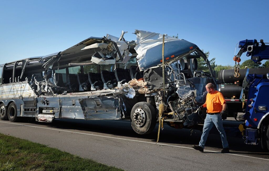 Greyhound bus crashes into tractortrailers in Illinois, killing 3 and