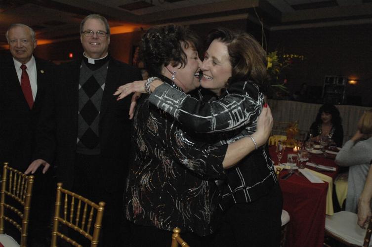 Julie Dobski hugs Linda Bowman