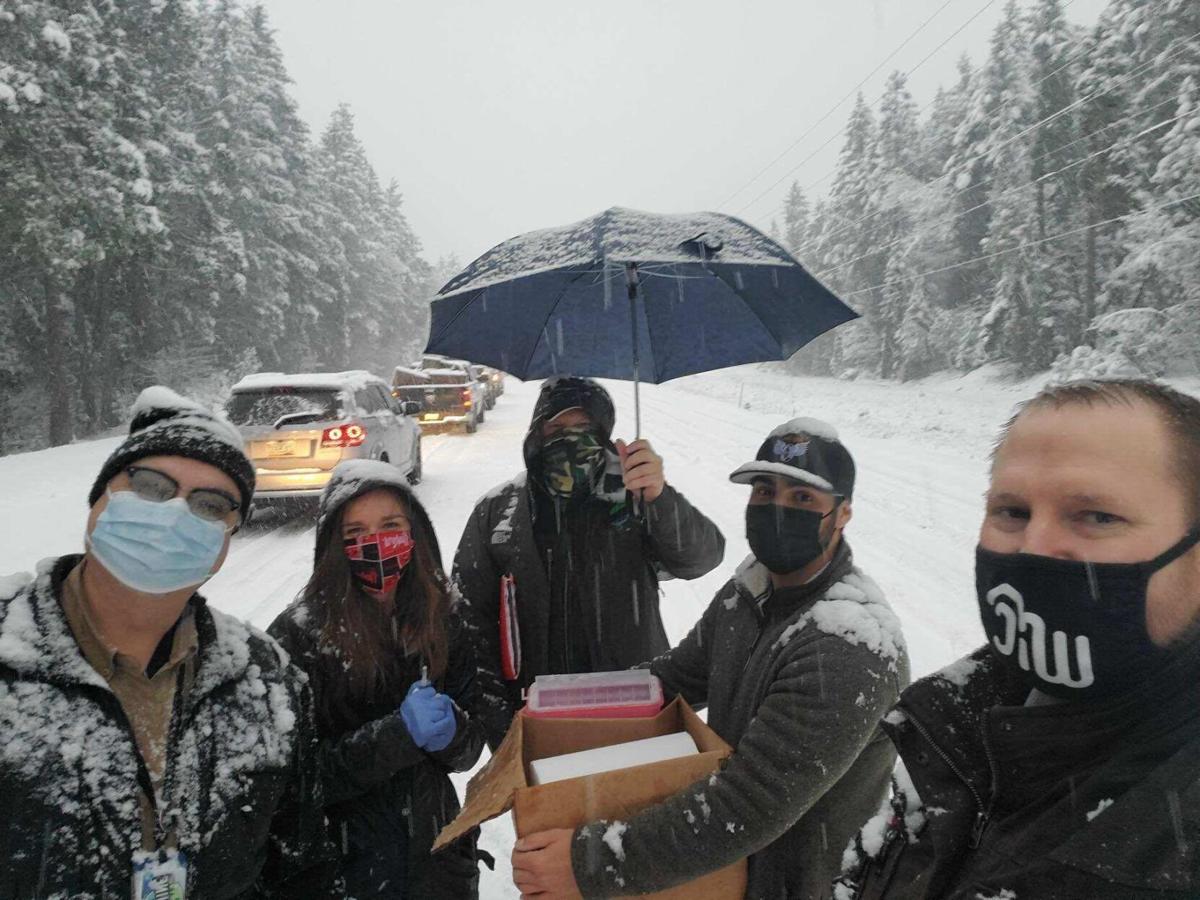 Oregon health workers stuck in snow give other drivers vaccine