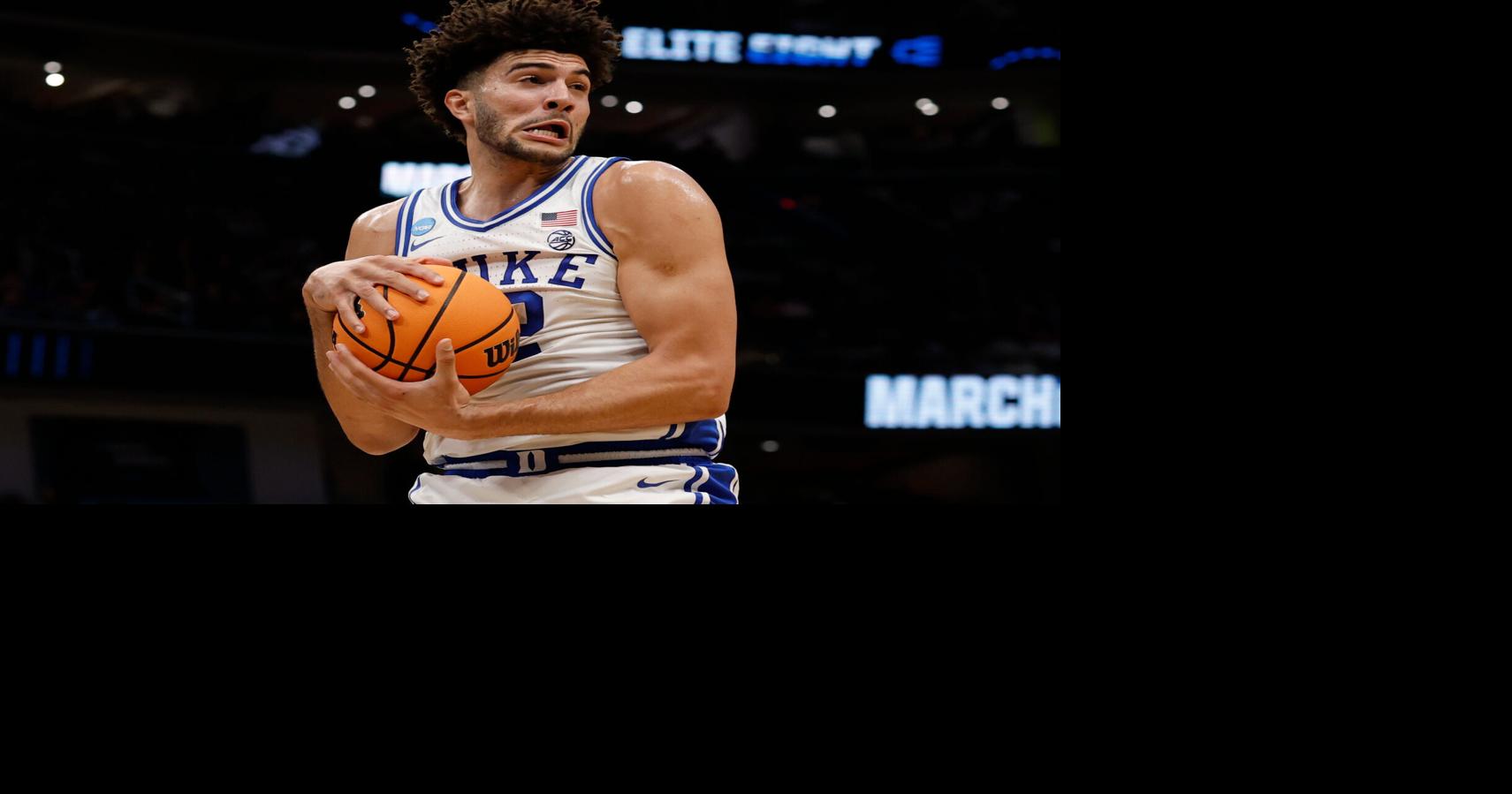Mar 29, 2026; Washington, DC, USA; Duke Blue Devils forward Cameron Boozer (12) rebounds the ball against the UConn Huskies in the first half during an Elite Eight game of the East Regional of the men's 2026 NCAA Tournament at Capital One Arena. Ma – The Pantagraph