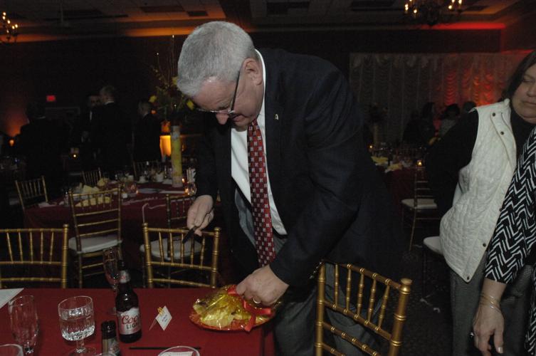 Dave Selzer busting into another table’s tray of goodies