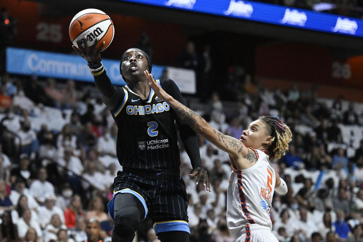Team WNBA's Kahleah Copper (2) passes to her teammate Courtney