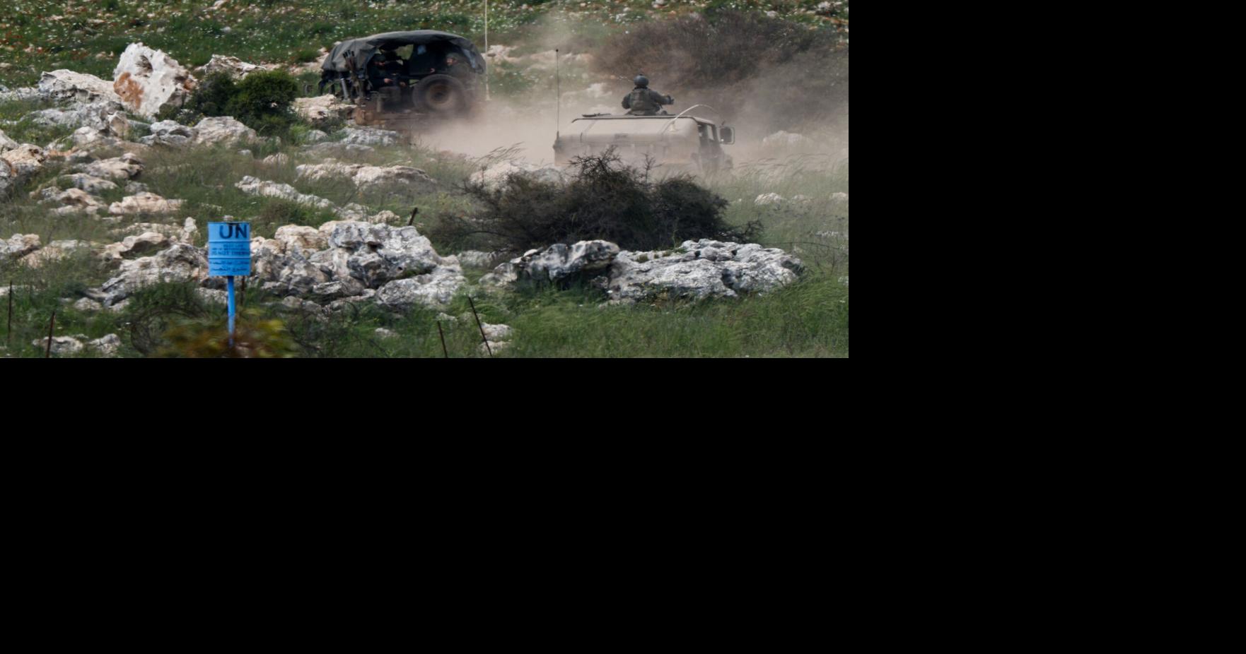 Israeli military vehicles manouvre in Lebanon, as seen from the Israeli side of the border