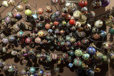Photos: Shaping blown glass into Christmas ornaments | World News