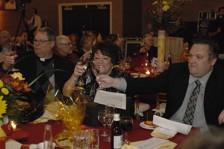 Julie Dobski and Steve Dobski sharing a toast