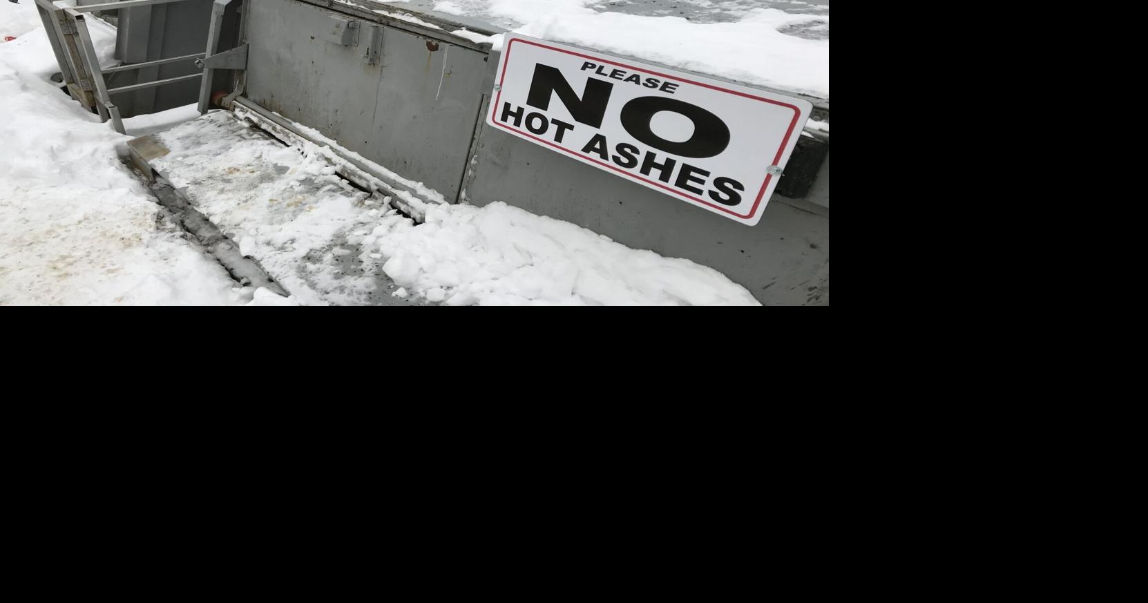 What's Going on Here No Hot Ashes signs on Seguin garbage bins