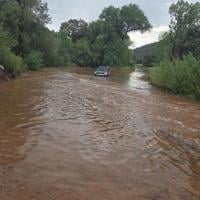 Driver rescued from flooded wash on Doll Baby Ranch Road