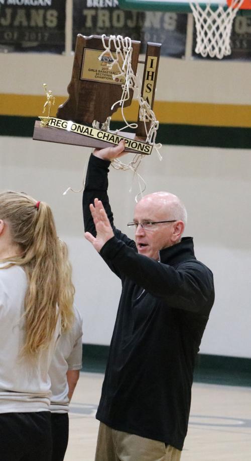 Principle Smith hoists the trophy
