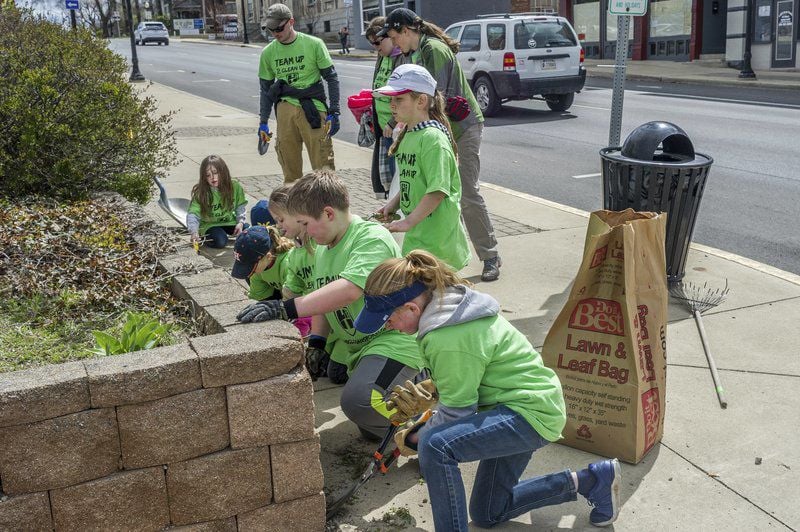 GREENER, CLEANER More than 100 volunteers participate in this year's
