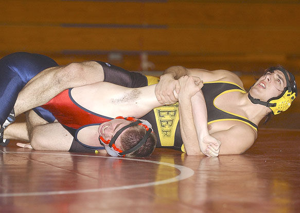 Wednesday's boys wrestling: Pins propel Pioneers over Trojans, Sports