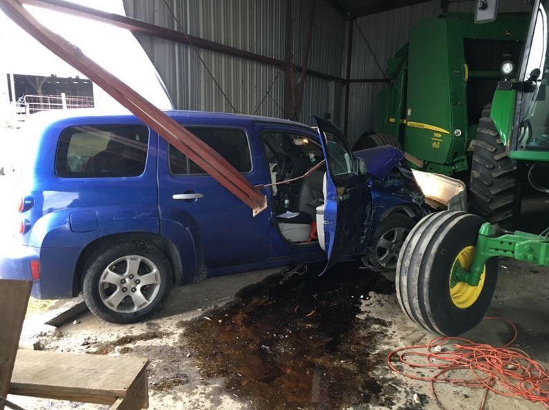 UPDATED Car crashes into barn, strikes tractor Local News