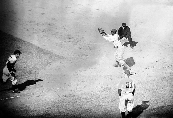 Dodger second baseman Jackie Robinson becomes the first black