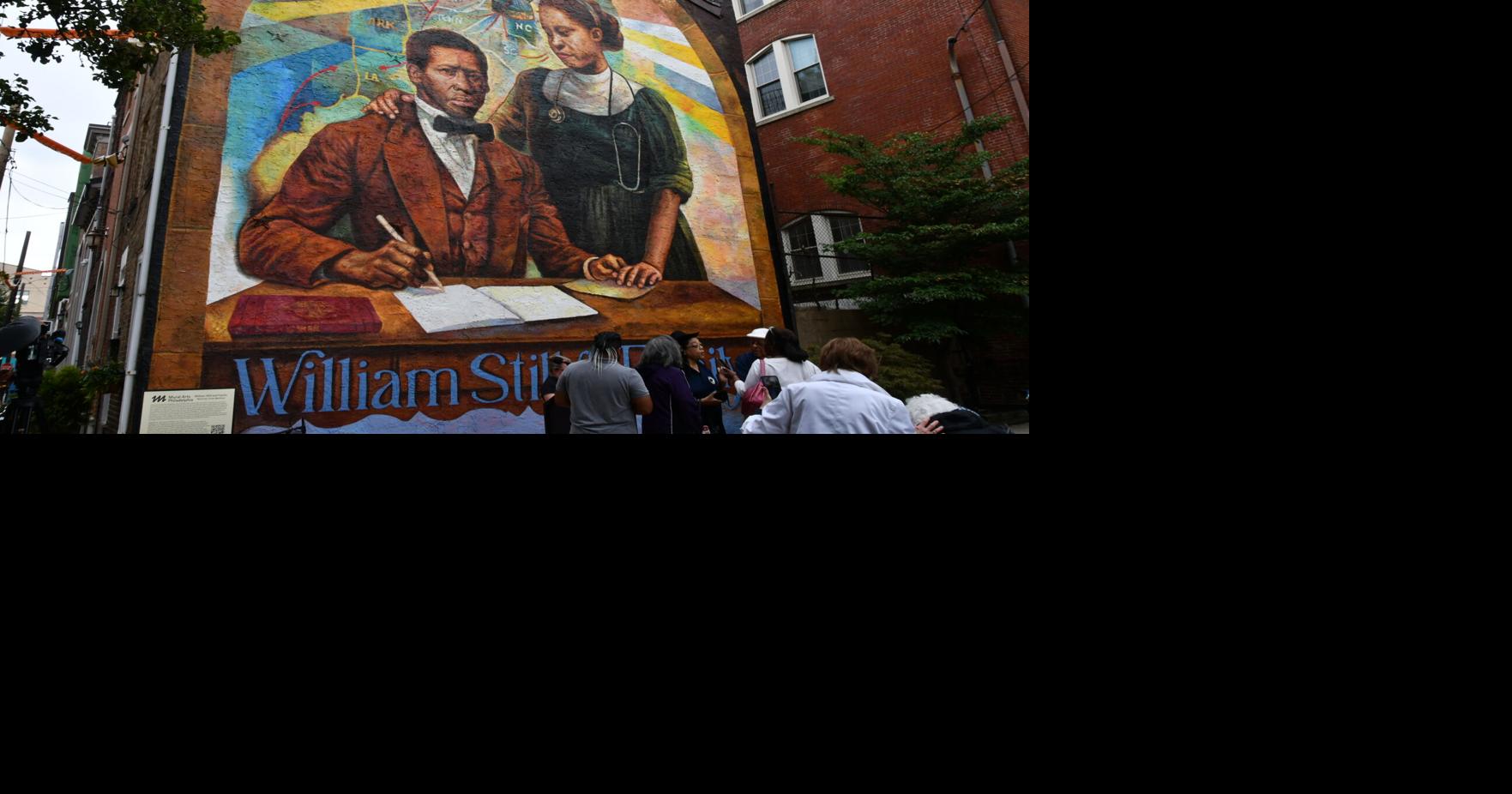 A mural featuring William Still and his wife signing a document