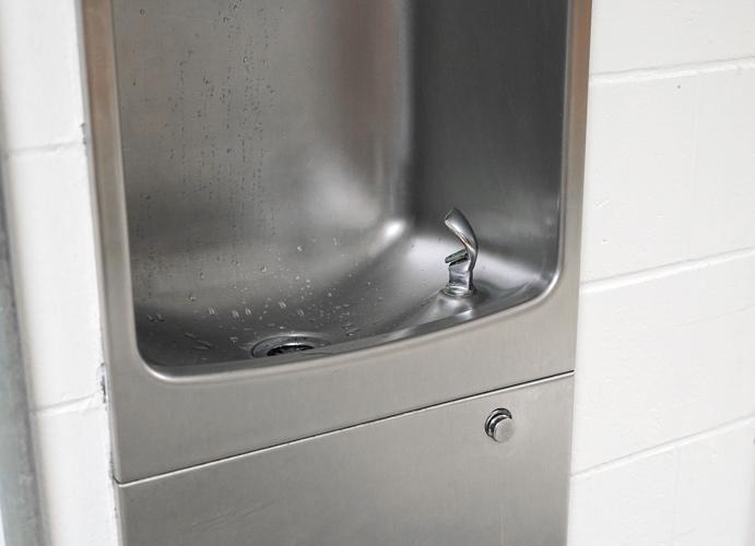 Close Up On Drinking Water Fountain In School