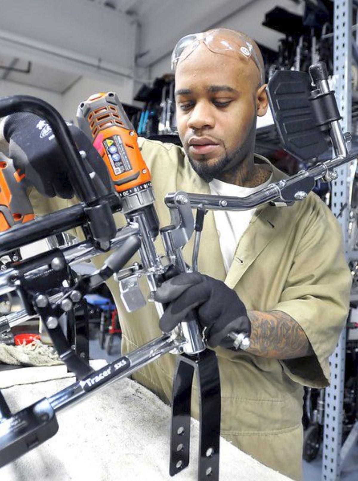 Inmates at Ind. prison refurbish wheelchairs for charity News