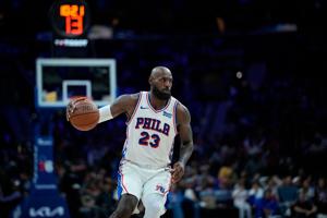 LeBron calls helicopter rides 'transportation' after he soars on big dunk in 76ers home debut