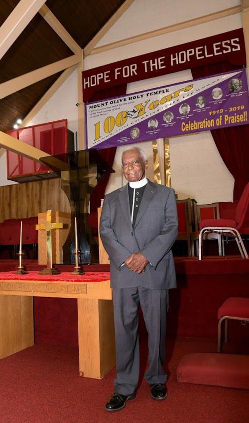 Bishop Thomas J. Martin Jr. stands inside the church.