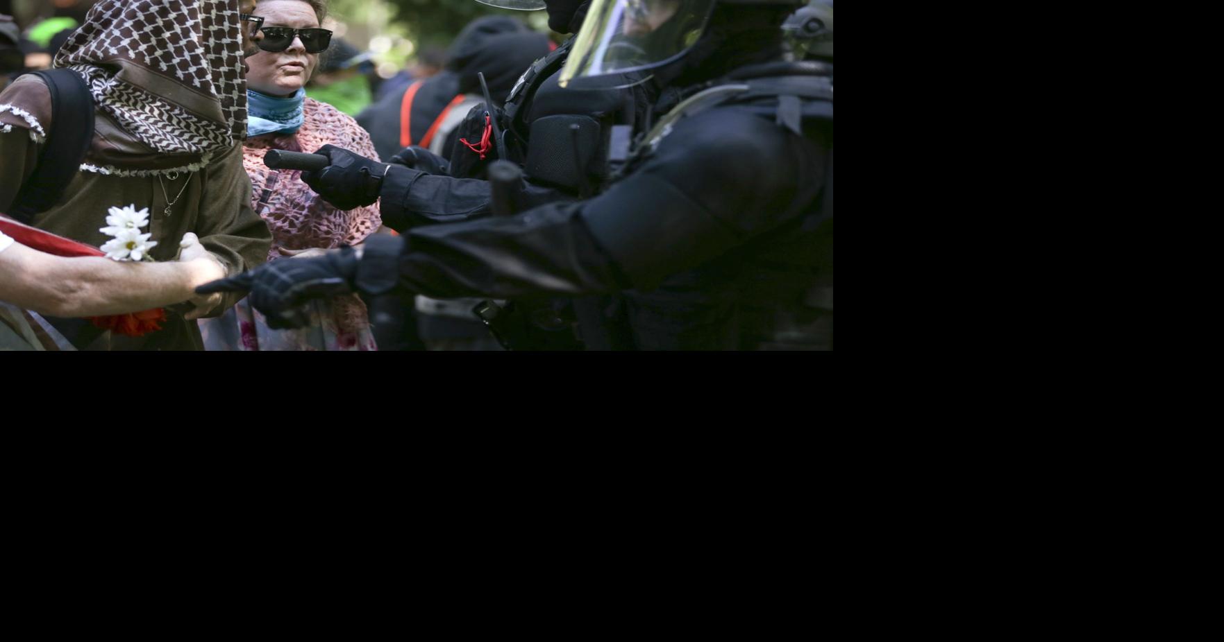 Portland police arrest 14 during rival protests, clashes | News ...