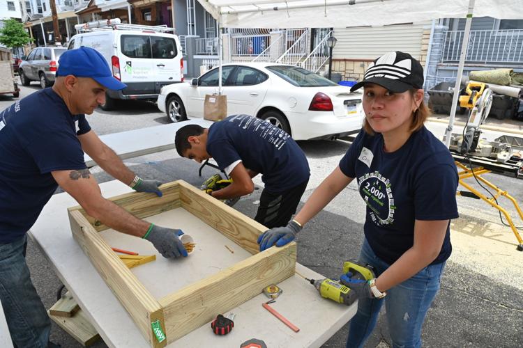 Volunteers help make repairs
