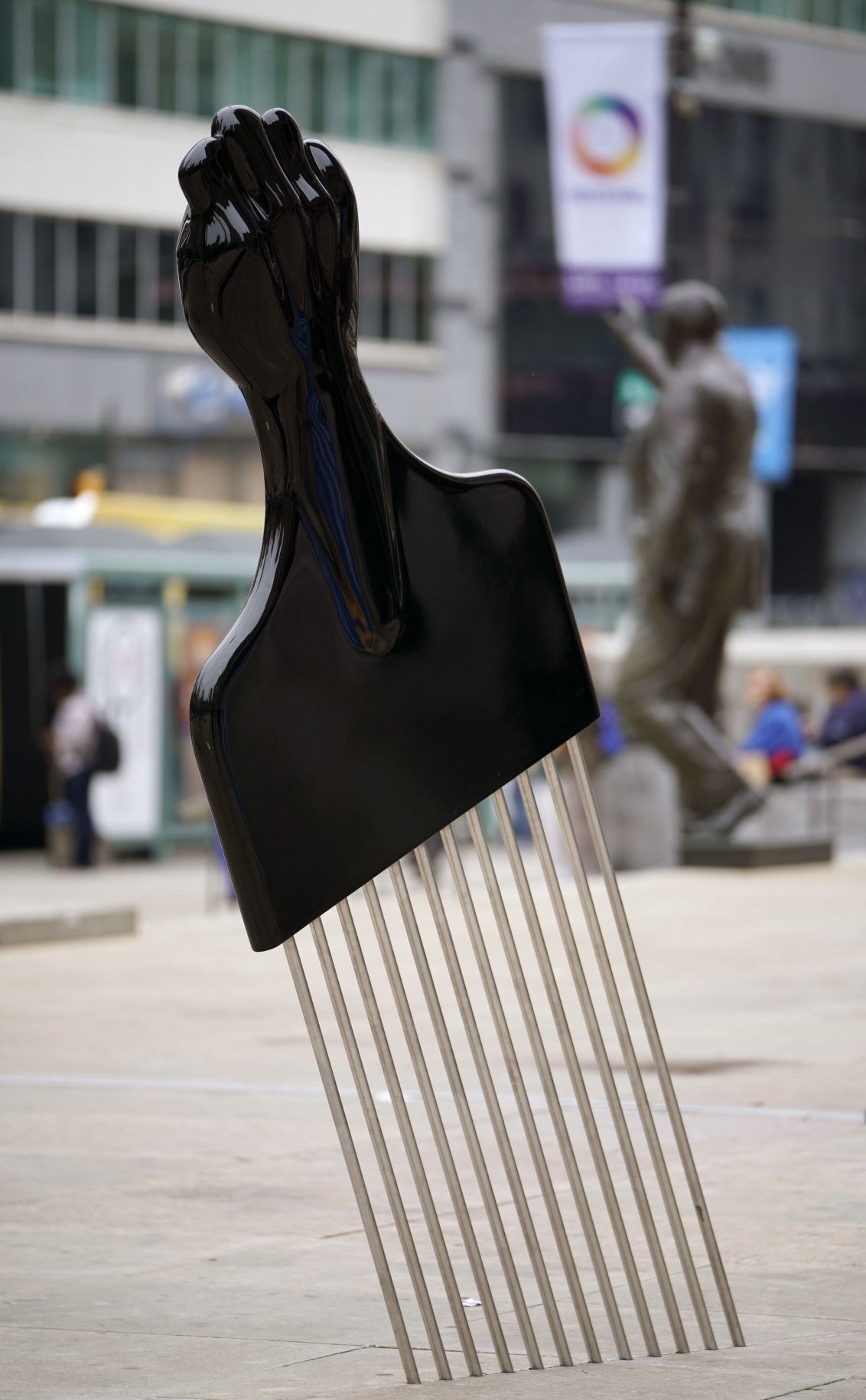 Afro pick art goes up near Rizzo sculpture