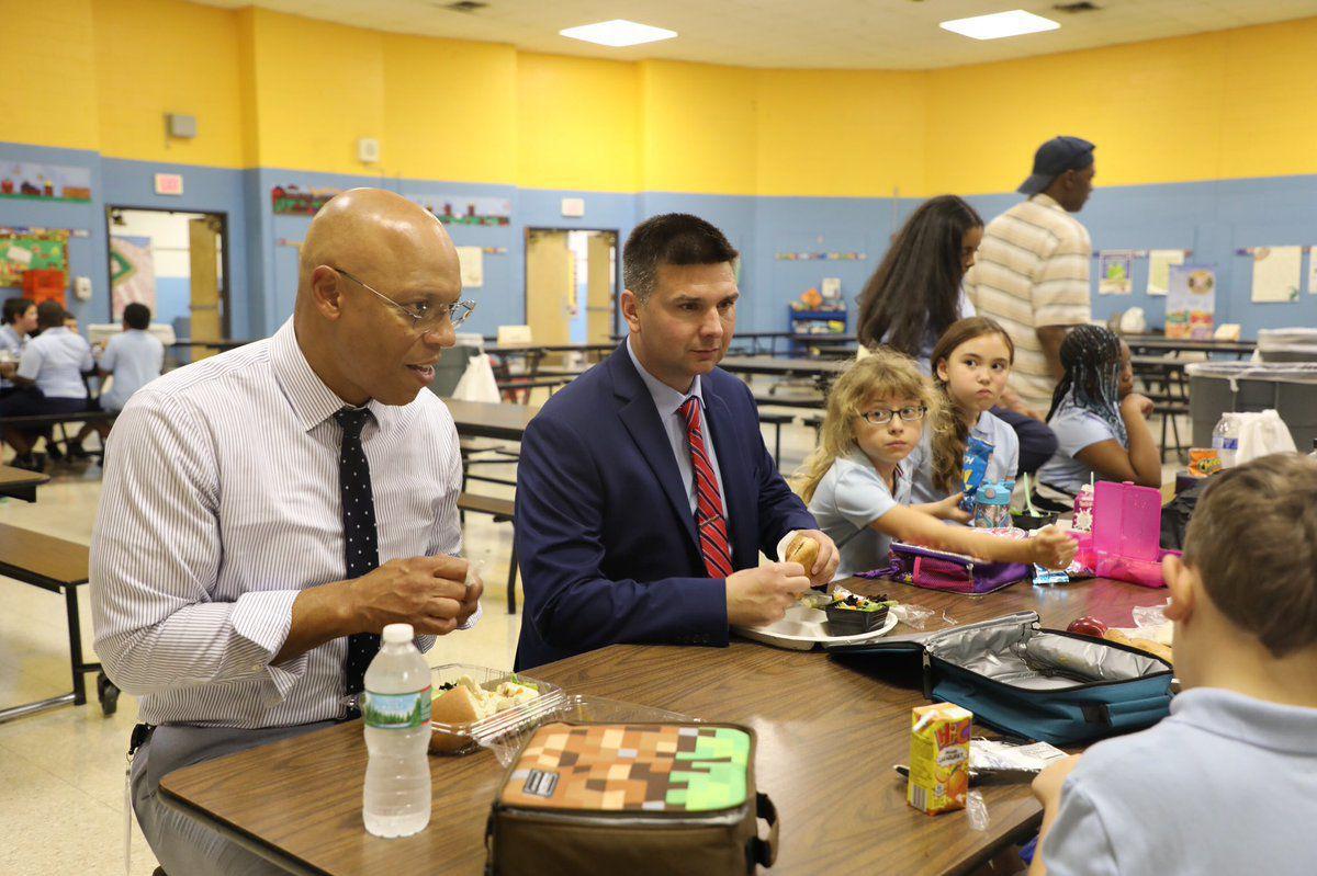 Elected officials, students, families rings the bell to start off new