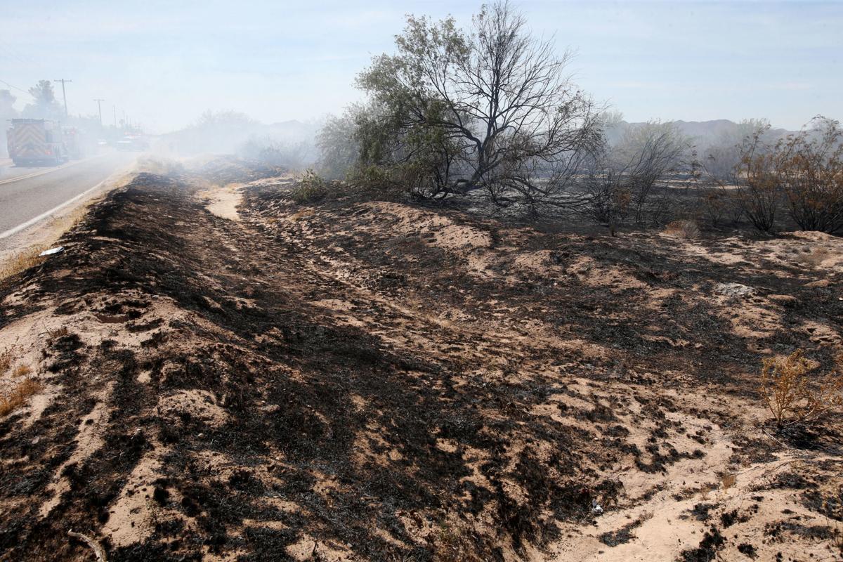 House fire causes brush fire