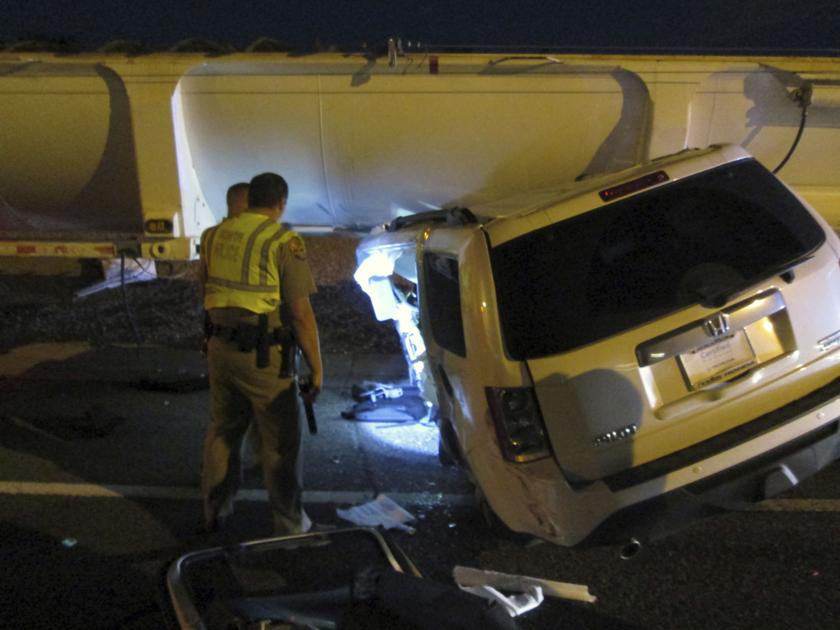Woman survives Chandler accident in which SUV ended up under big rig