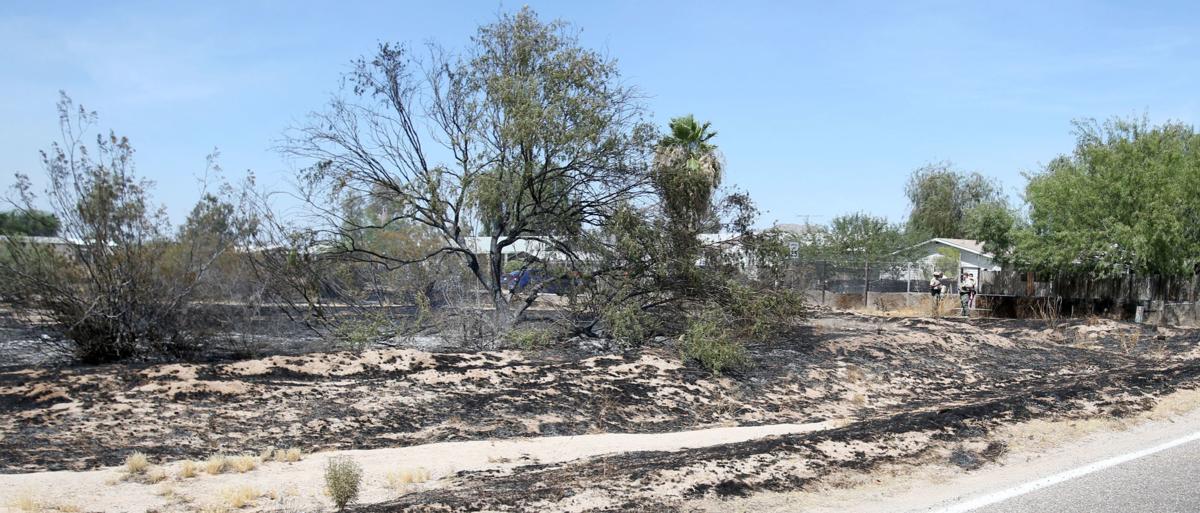 House fire causes brush fire