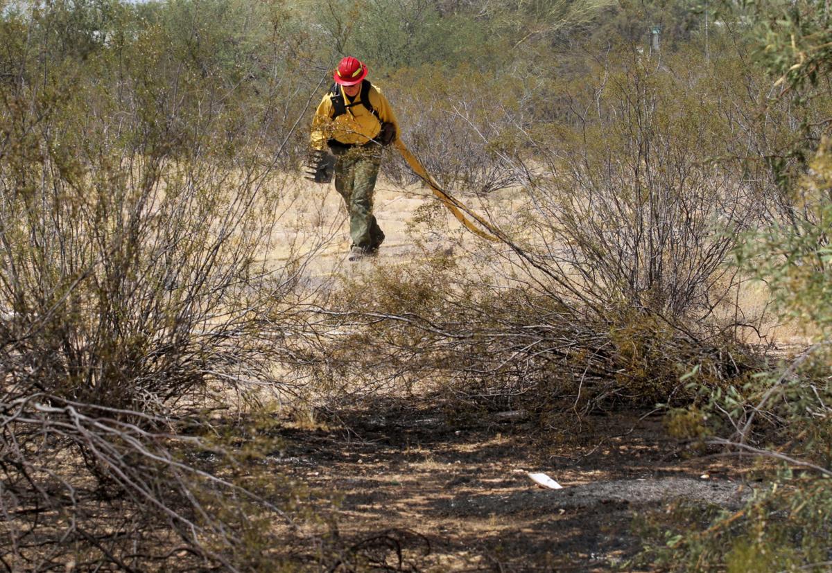 House fire causes brush fire