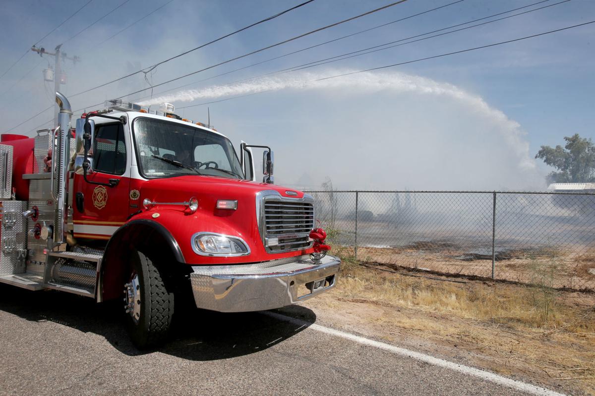House fire causes brush fire