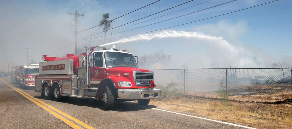 House fire causes brush fire