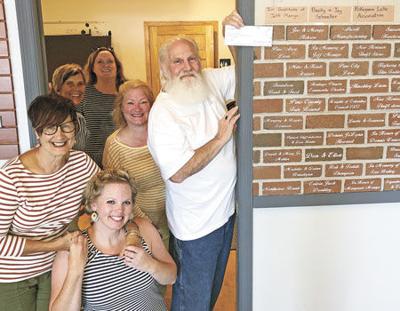Pokegama Lake Association gives Pine Center for the Arts another brick in the wall