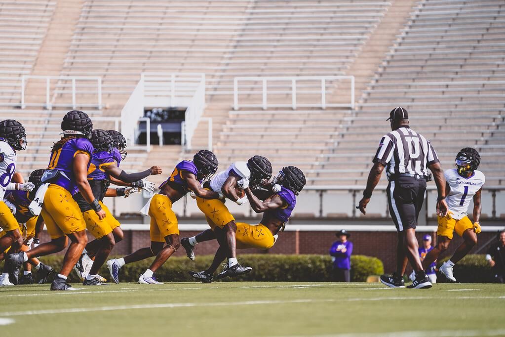 Pirates Drop Opener At No. 2 Michigan, 30-3 - East Carolina University  Athletics