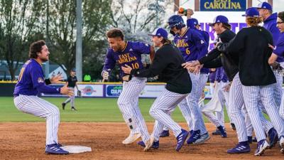 The Pirates celebrate with junior infielder Jacob Starling after hitting the walk off homerun.