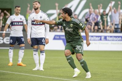 Timbers Evander points to teammate Juan David Mosquera after Evander scored against Vancouver