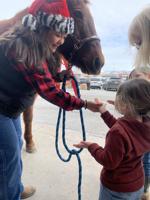Salvation Army bell-ringers horse around for a good cause