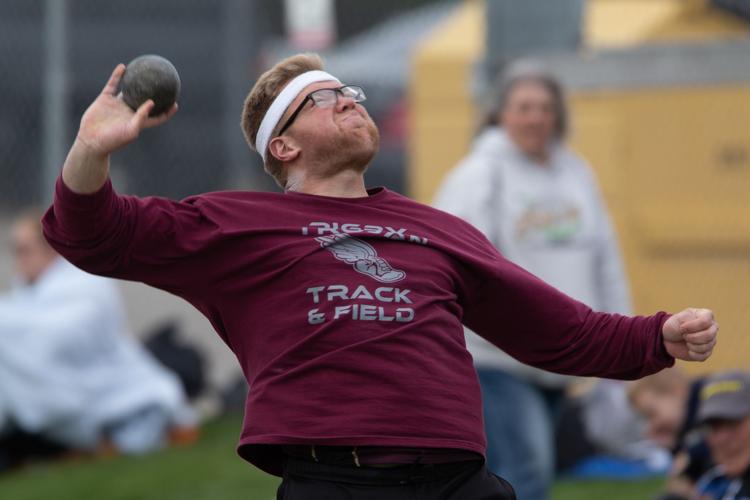 Track and field athletes battle through wind to claim titles to start