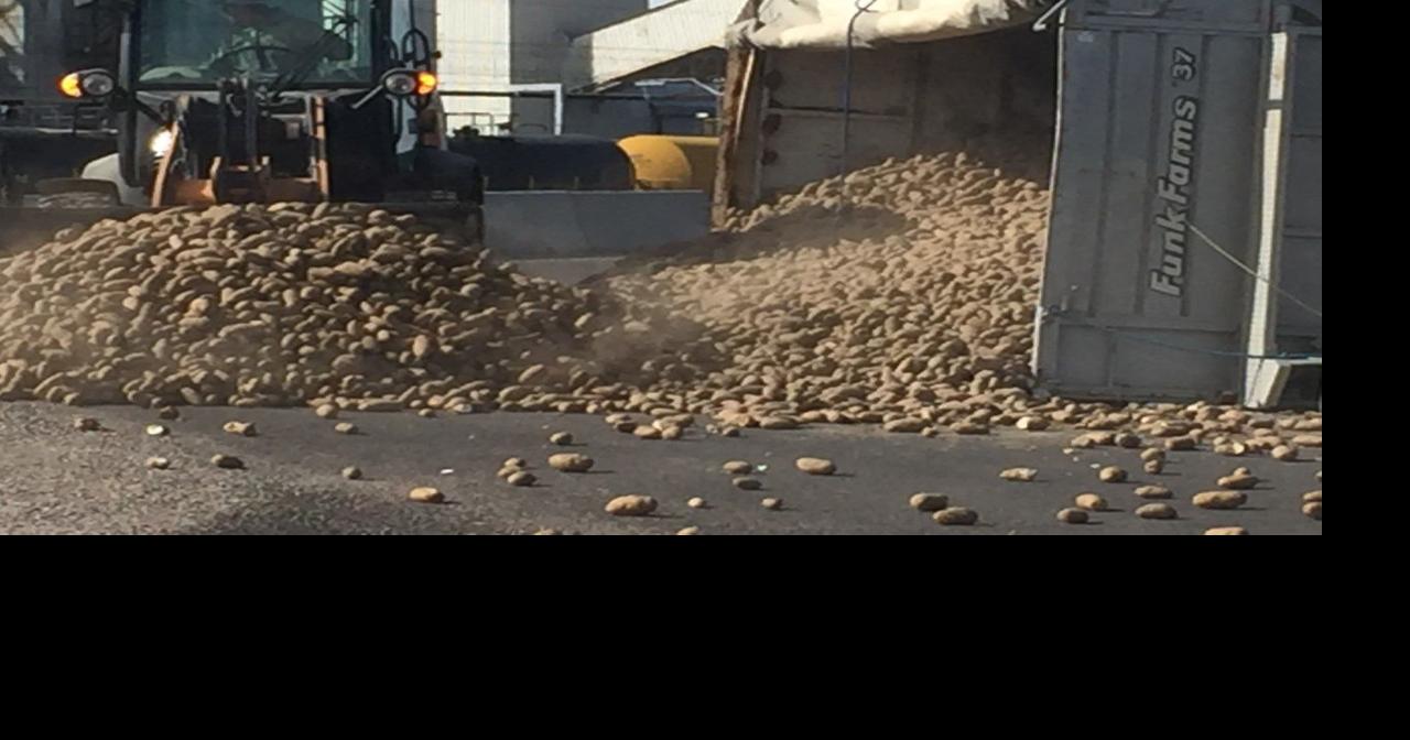 Truck topples over near J.R. Simplot Don Plant spilling potatoes onto ...