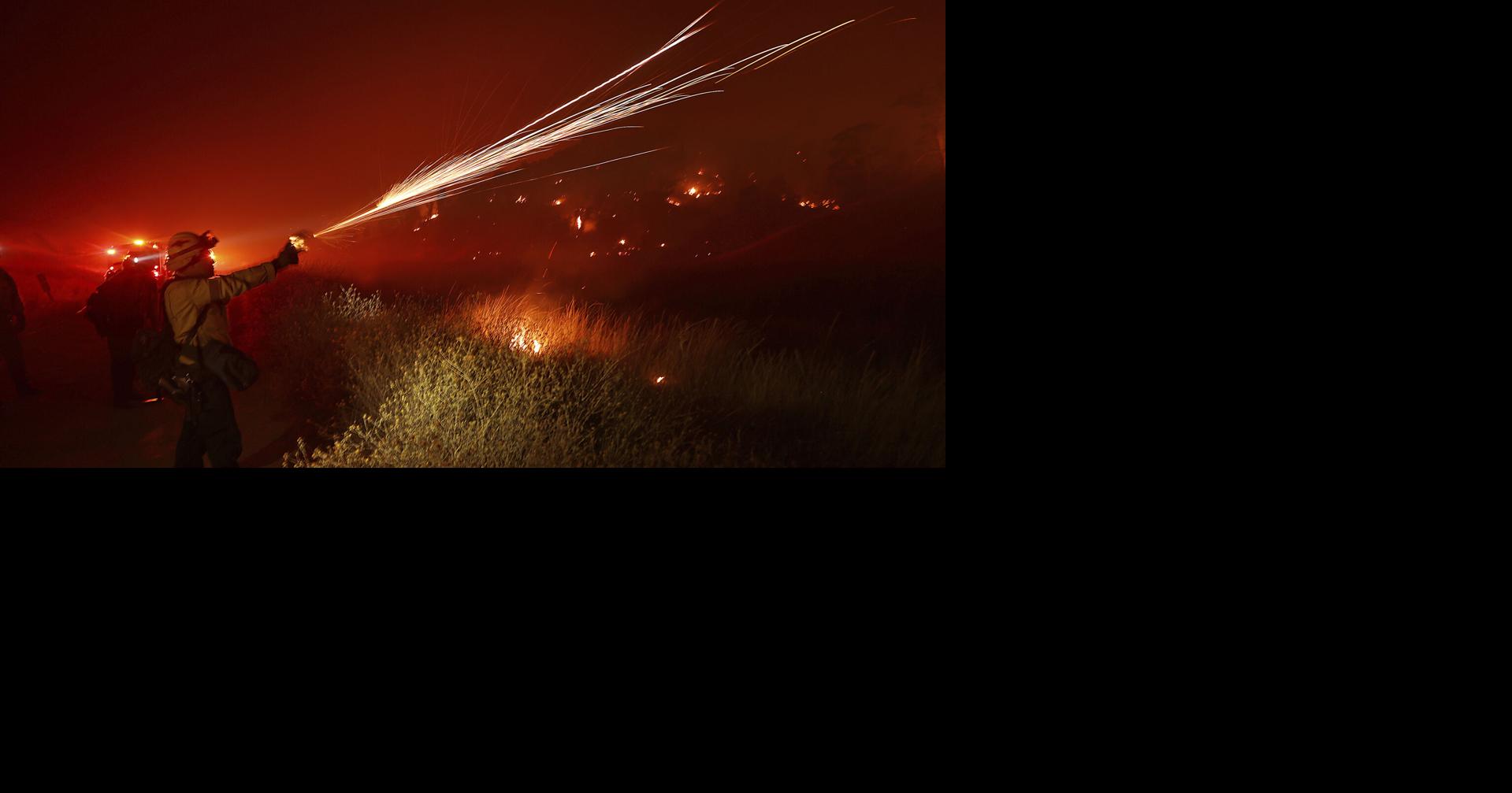 Wildfires plague the West amid scorching heat wave. Homes burn in ...