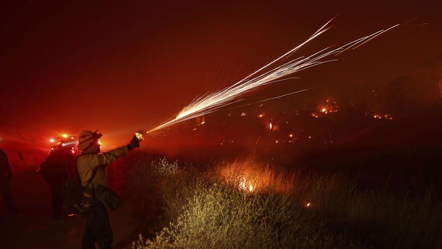 Wildfires plague the West amid scorching heat wave. Homes burn in ...