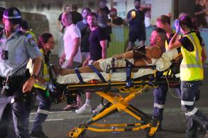 Father and son gunmen kill at least 15 people in attack on Hanukkah event at Sydney's Bondi Beach