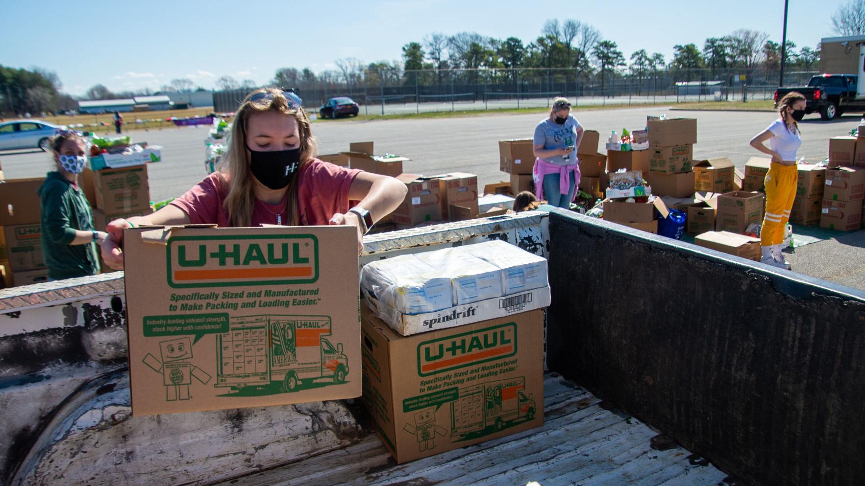 Volunteers hand out nearly 16,000 pounds of food at Hudson Falls High School