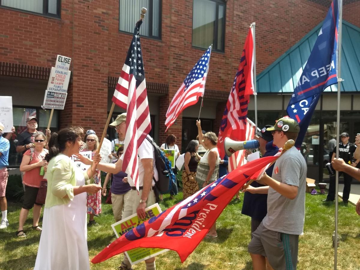 Protesters and counterprotesters demonstrate outside Stefanik's office