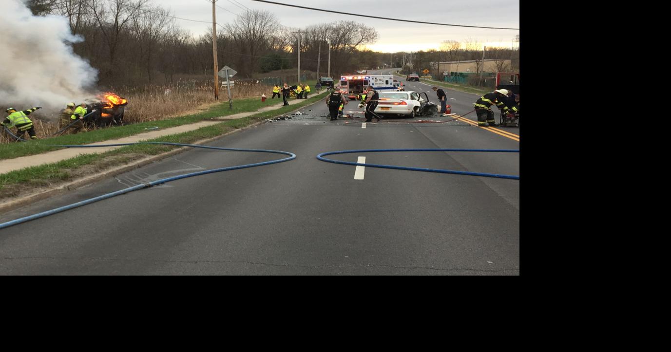 Woman pulled from burning vehicle after head-on crash