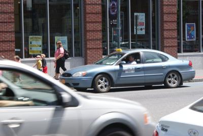 City to review taxi fares, regulations